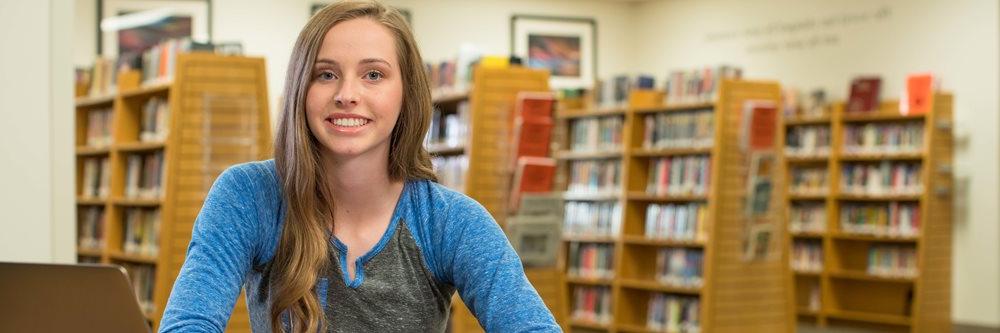 Smiling student in the campus library